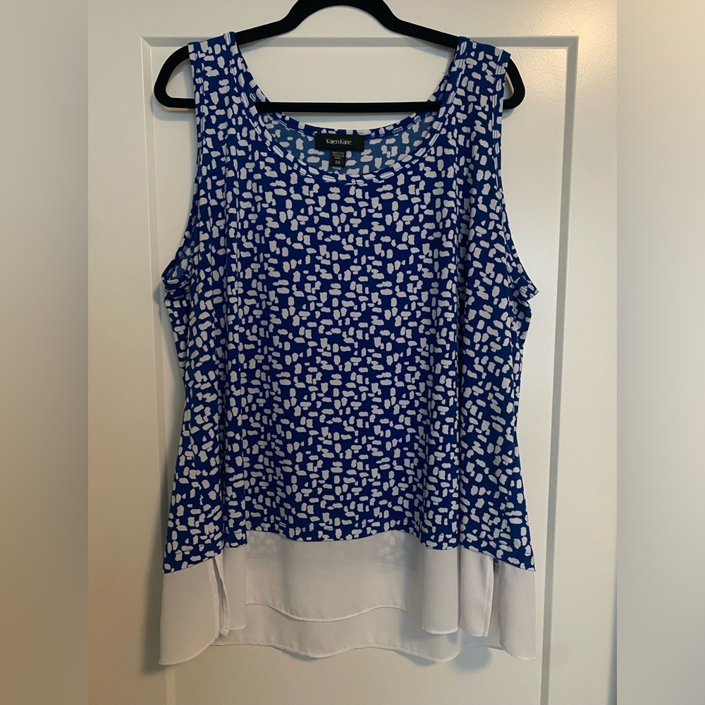 Karen Kane blue printed blouse with sheer drop hem